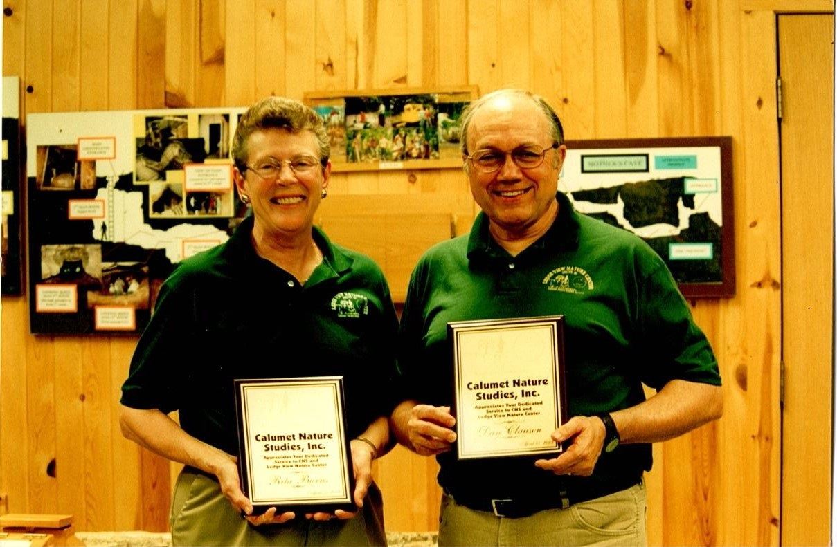 Rita Burns and Dan Clausen holding a Calumet Nature Studies Certificate